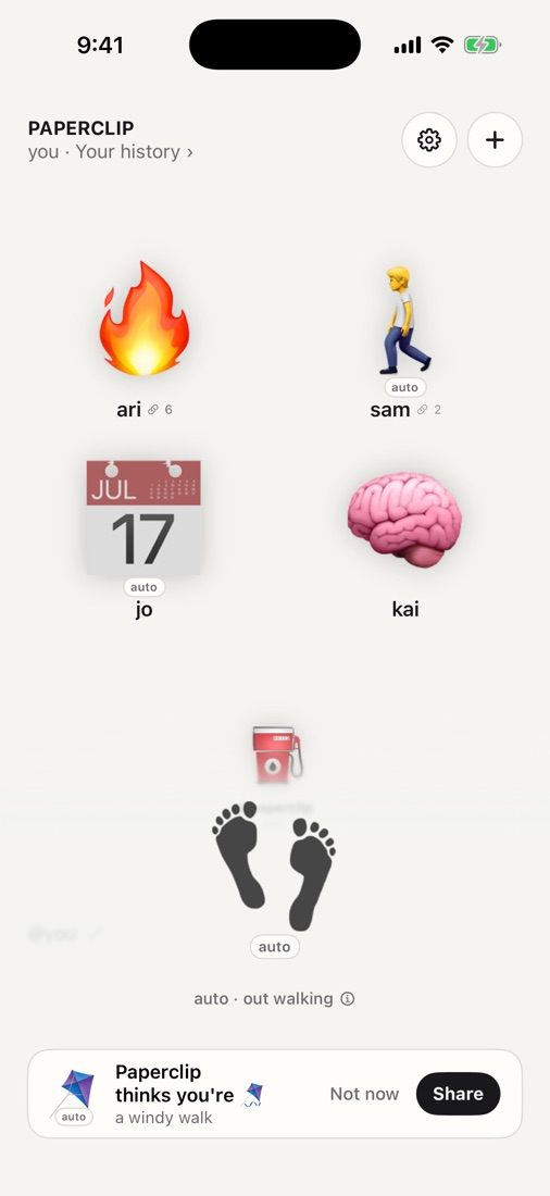 Auto status suggesting an emoji, with Share and Not now